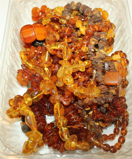 Quantity of amber and simulated amber necklaces etc.